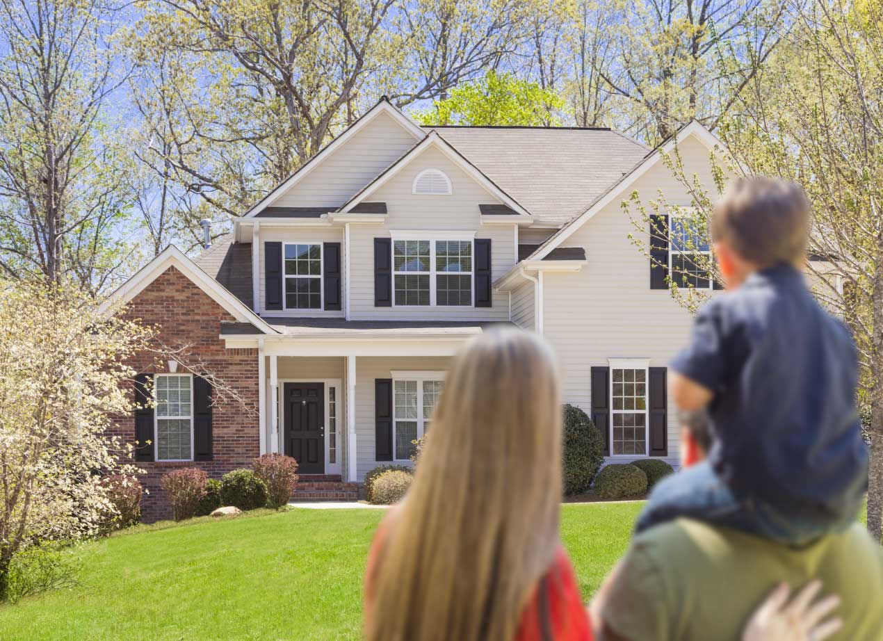 Family looking at their home